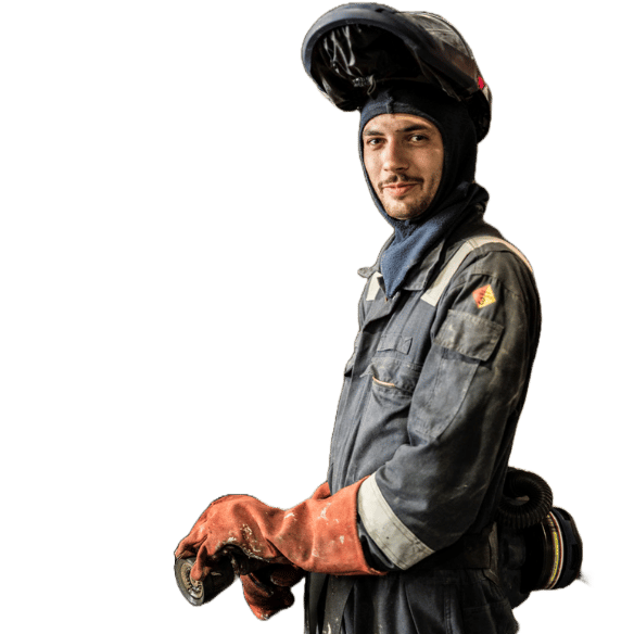 Element fire safety engineer in protective gear conducting building materials flammability testing