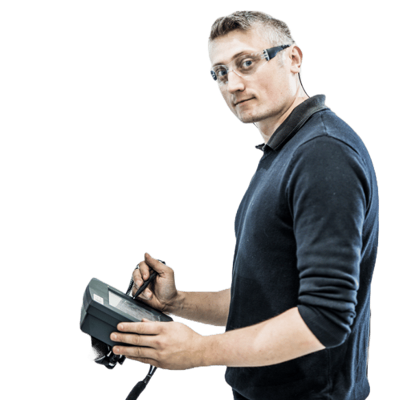 Element testing specialist standing among environmental test chambers in product testing lab