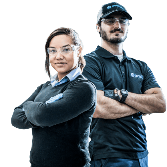 Two Element testing experts in laboratory safety equipment ready for testing