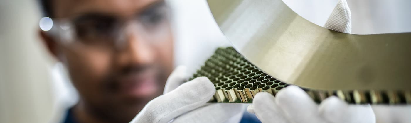 Testing engineer observing composite sandwich panel