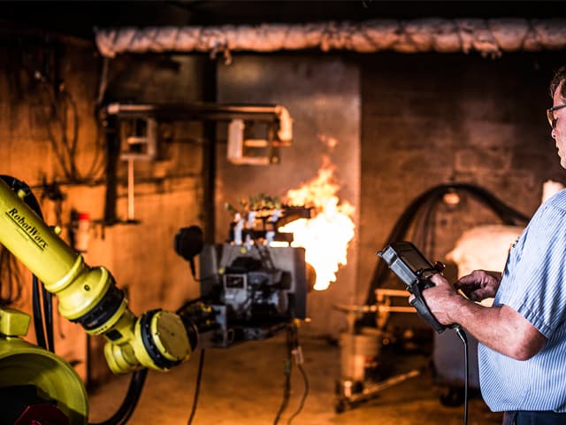 Element fire testing services engineer observing controlled burn test for building materials safety