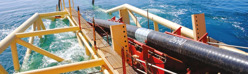 Pipeline extending into the ocean from a metal structure