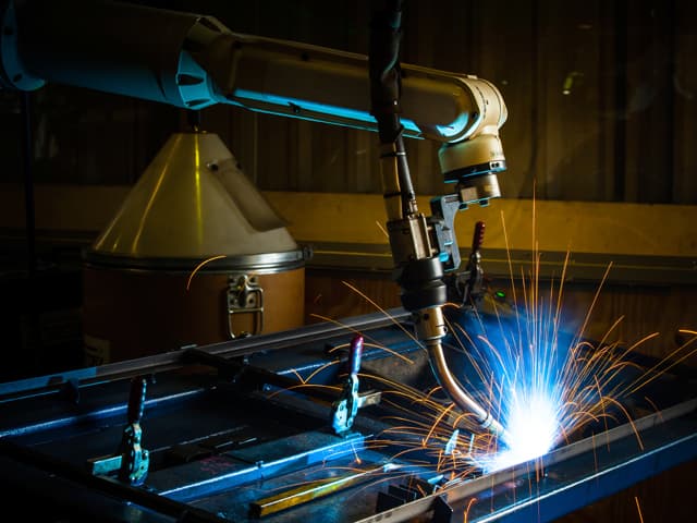 Welding professional welding in a subsea pipeline wearing protective equipment
