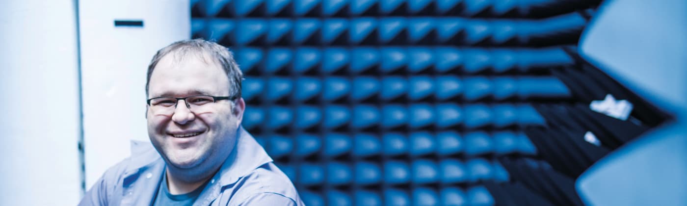 Element testing engineer in anechoic chamber providing product compliance services