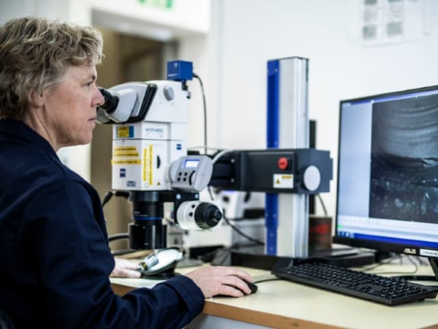 fiber reinforced composite materials using macroscopic and microscopic evaluation