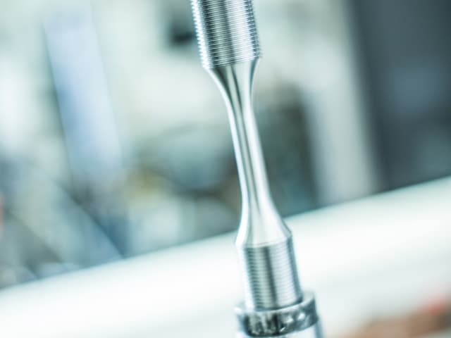 slow strain rate testing equipment within a laboratory