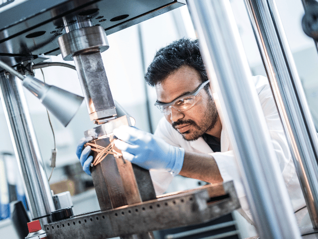 Element materials scientist conducting precision testing with advanced laboratory instrumentation