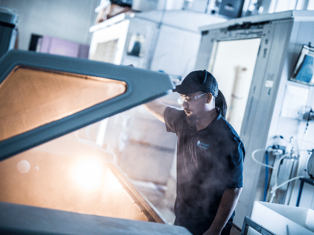 Element testing engineer operating salt fog chamber for product environmental testing